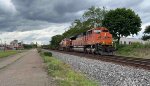 BNSF 8792 leads the empty blade runner.